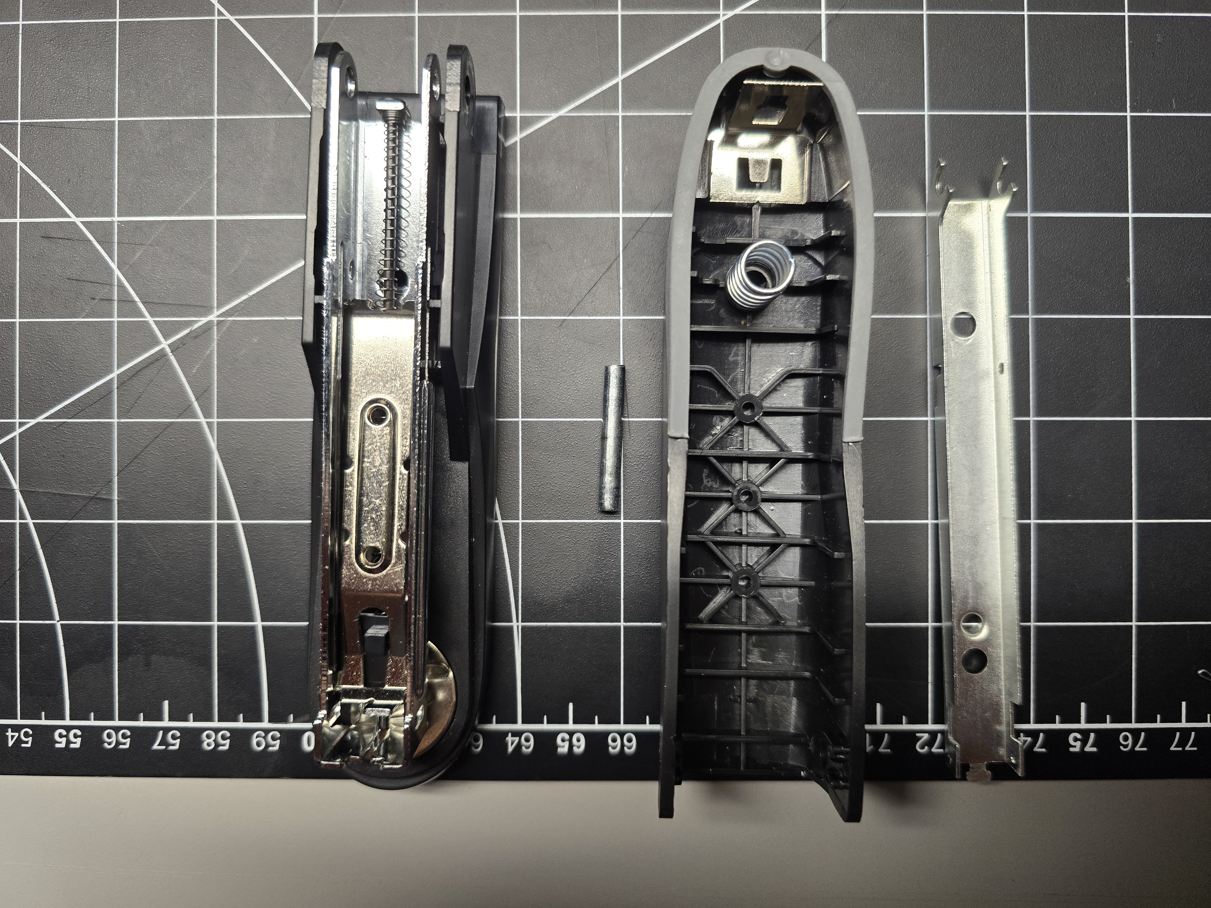 Top-down view of stapler components laid out