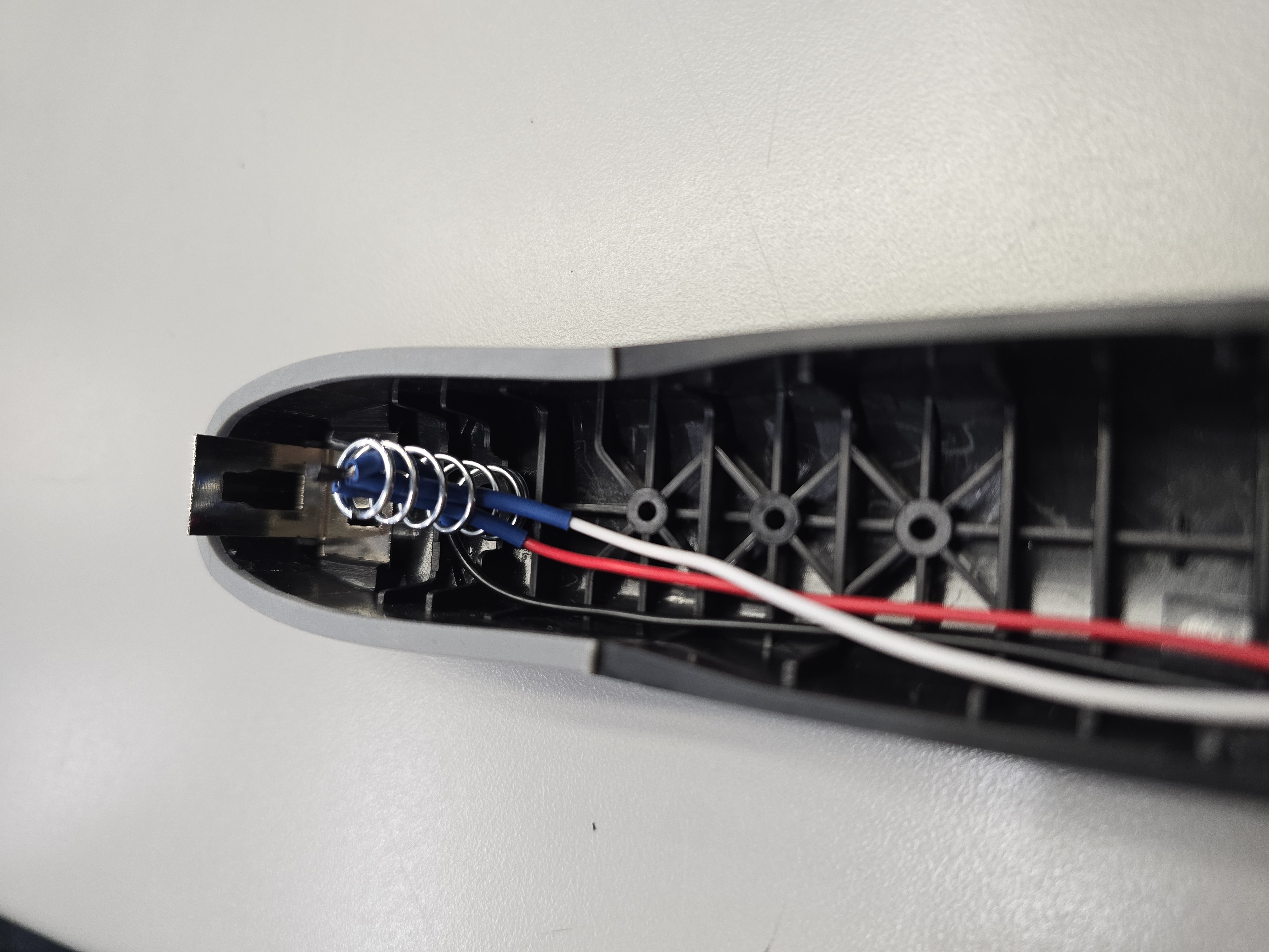 Hall sensor harness routed inside stapler shell